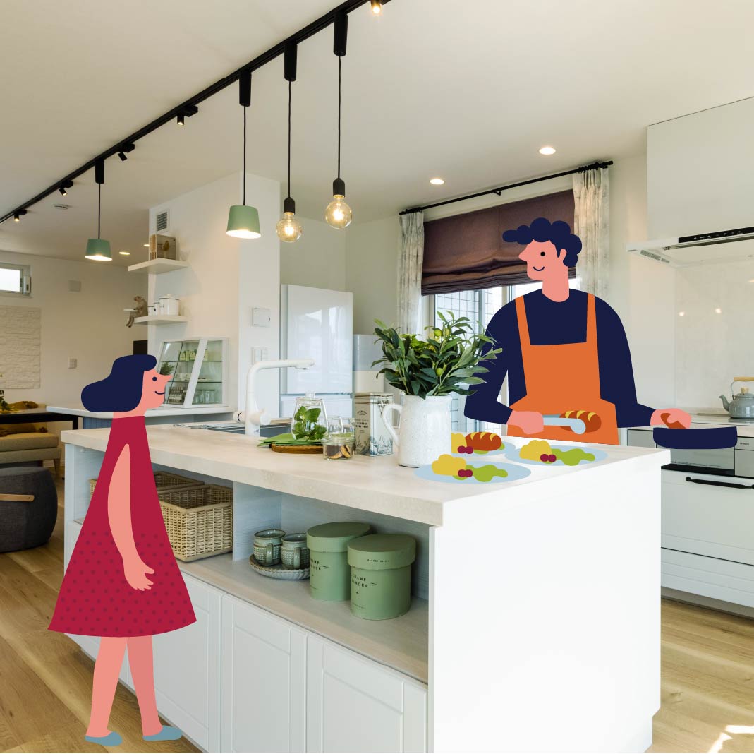 料理をする父親と手伝いをする娘の画像