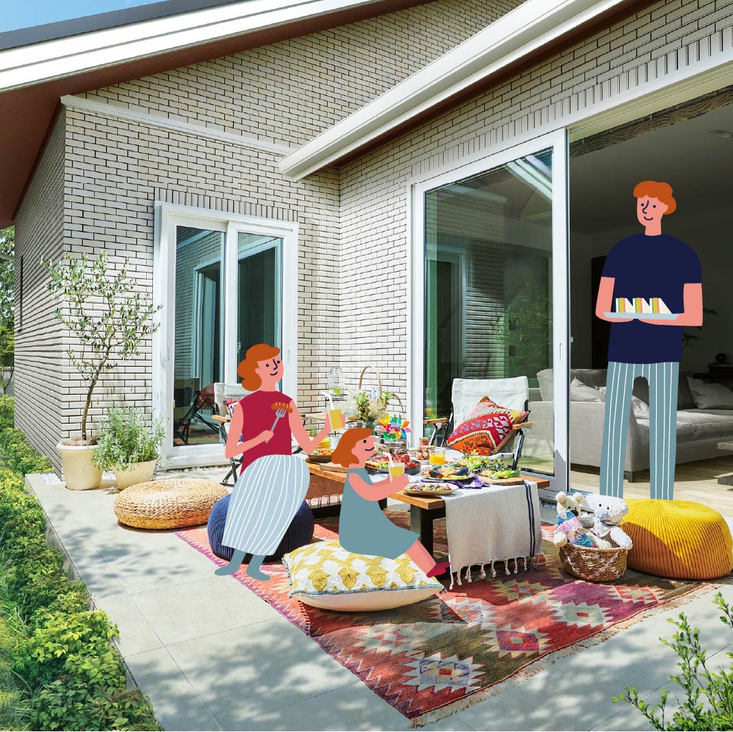 庭で食事を楽しむ家族の画像